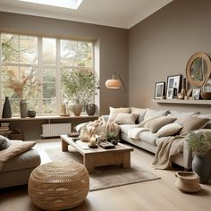 a living room filled with furniture and lots of windows