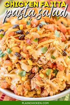 chicken fajita pasta salad in a white bowl on a colorful table cloth with text overlay