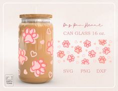 a glass jar with pink hearts and paw prints on it next to a white background