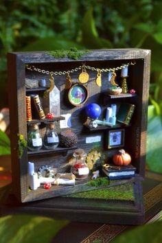 a miniature shelf with many items on it