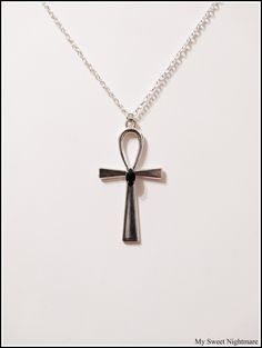 "◆ Pendant with Ankh cross The pendant measures 2.16535 x 1.1811 inches and it is silver plated, a beautiful black teardrop crystal is set in the center. the size of the chain is adjustable but for any need you can contact me :) The product is handmade with great care. ♡ In my shop there are many handmade jewels for all tastes, come and look at them you are welcome! ♡ -------------------------------------------------------------------------- The Ankh cross is perfect to wear around the neck and Sakura Wall, Black Moon Lilith, The Ankh, Ankh Cross, Witch Necklace, Pagan Jewelry, Handmade Jewel, Personalized Pendant, Moon Jewelry