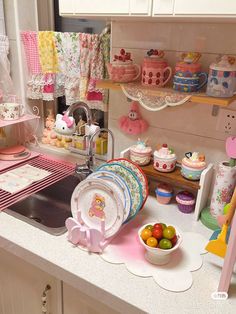 a kitchen filled with lots of dishes and cupcakes