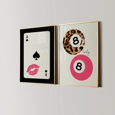 two framed art pieces with pink and black designs