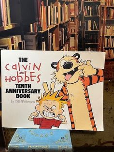 a children's book with an image of a tiger and a cartoon character on it