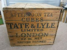 a wooden crate sitting on top of a carpeted floor