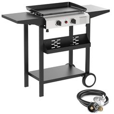 an outdoor gas grill with hoses attached to it and the side burner plugged in