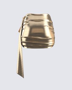 This golden drape skirt is your key to instant glam ✨ Made from lame jersey fabric, and complete with an asymmetrical hem, sash detail, ruching detail, and an elastic waistband - this skirt has a luminous allure perfect for stealing the spotlight anywhere you go 😌 Gold Mini Skirt For Evening, Elegant Party Bottoms With Ruched Sides, Asymmetrical Ruched Draped Skirt For Party, Ruched Draped Bottoms For Party, Ruched Draped Party Bottoms, Party Draped Skirt With Ruched Detail, Party Skirt With Ruched Draped Design, Chic Gold Skirt, Glamorous Gold Mini Skirt