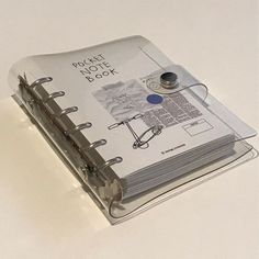 an open binder on top of a white table