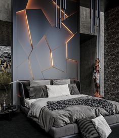 a modern bedroom with black and grey walls, an abstract wallpaper and a large bed