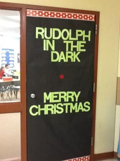 a door decorated with the words rudolph in the dark and merry christmas