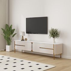 a flat screen tv mounted to the side of a white wall in a living room