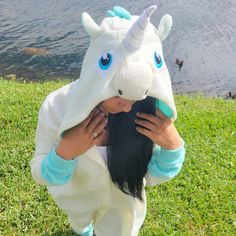 a girl in a dragon costume holding her hair