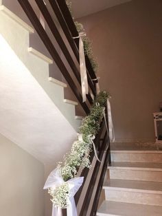 the stairs are decorated with ribbons and flowers