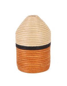 HANDWOVEN IN RWANDA Intricately crafted with timeless tradition, this carefully dyed sisal fiber and sweet grass vase makes a stunning statement piece. One or more of these vases, will make a globally conscious and stylistic addition to your home.Style it on your shelf or kitchen table for a globally inspired look. Specifications: Approximately 3.5” D x 6.2” H Made in Rwanda Product is made from all natural fibers of sisal and sweet grass Organic dyes are used to dye the sisal Profiled weaver tag is attached to each product *All products are made by hand with love and vary slightly in color and size. Made only in an ethical, fair trade environment. Handwoven by a cooperative of women located in Rwanda, this one of kind piece takes weeks to complete. Garden Furniture Design, Basket Wall Art, Home Decor Baskets, Bath Candles, Candle Vase, Home Style, Baskets On Wall