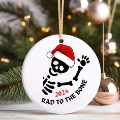 a christmas ornament with a skull and santa hat on it