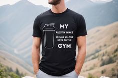 Get ready to add a dose of humor and fitness to your gym sessions with our Funny Gym t-shirt! This shirt is perfect for the gym enthusiasts, weightlifters, and bodybuilding dads out there who love to bring some laughter to their workout routines. Designed with a clever and funny graphic, this shirt is sure to make a statement and elicit some laughs from fellow gym-goers. Whether it's Father's Day, his birthday, or any special occasion, this Funny Gym t-shirt makes a fantastic gift for the fitness-loving dad in your life. Made from high-quality materials, this shirt ensures comfort and durability during intense workouts. Its versatile design makes it suitable for all fitness activities, from weightlifting to cardio sessions. This Funny Gym t-shirt is not only a great addition to your dad's Sporty Graphic Print Shirt For Gym, Sporty Gym Shirt With Letter Print, Black Pre-shrunk Workout Shirt, Sporty Letter Print Shirt For Workout, Gym Gifts For Him, Funny Gym Shirt, Weightlifting Shirts, Funny Gym Shirts, Funny Workout Shirts