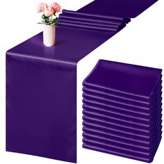 purple plastic table runners and vase with flowers