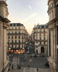 an aerial view of a city street with tall buildings