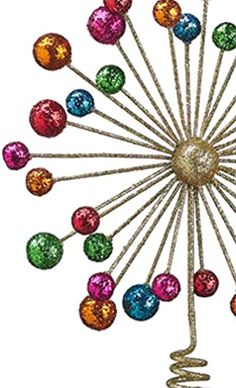 a metal pinwheel with lots of colorful balls on it