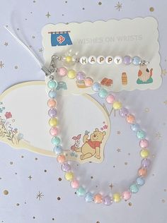 a winnie the pooh necklace and bracelet