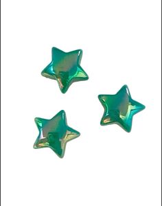 three shiny green stars on a white background