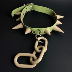 Introducing the Sage Green / Khaki Chunky Spike collar! This collar is 1.5" wide, adjustable, and can fit a neck size circumference range of: 19"- 26" inches. It weighs approximately 1lb.  Features and Materials: *Optional removable chain *Chain dimensions approx 9" x 2" *Adjustable collar circumference range of 19"- 26" inches. The smaller the circumference, the longer the tail of the collar will be.  *The spikes are tapered to create a blunted non-sharp edge.  *Made from sage green faux leathe Spiked Collar, Chain Collar, Nickel Plating, Costume Hats, Green And Khaki, Mild Soap, Costume Accessories, Sage Green, Headpiece