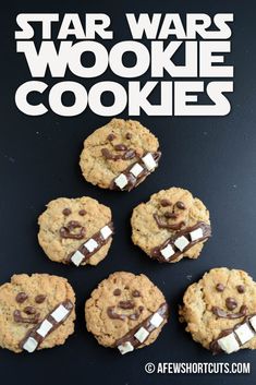 cookies with marshmallows and chocolate chips in the middle on a black surface