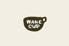 the words wake cup are written in white on a black and brown background with an oval shape