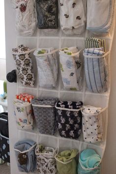 the hanging organizer is filled with many different items and has several pockets on each side