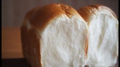 two loaves of bread sitting on top of a table