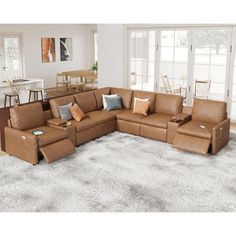 a living room filled with furniture on top of a white carpeted floor next to windows