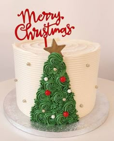 a christmas tree cake is decorated with icing