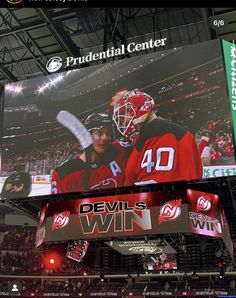 an image of a hockey game being played on the big screen in the arena with fans watching