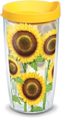 the sunflowers are painted on the side of this plastic tumbler cup with yellow lid