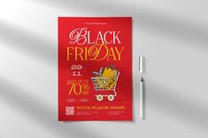 a black friday sale poster with a shopping cart on it and a pen next to it