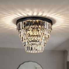 a chandelier hanging from the ceiling in a room