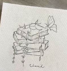 a drawing of books stacked on top of each other with a butterfly flying over them