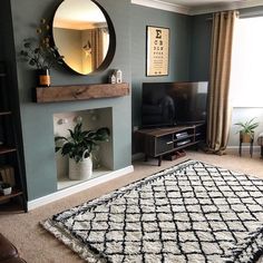 the living room is clean and ready to be used for tvs, bookshelves, and other things