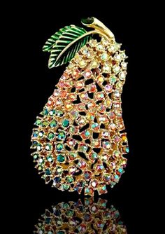 44.00 USD  Pear AB Rhinestone KRAMER Brooch, Fruit Floral, Open Work Setting, Vintage  Really lovely pear brooch by Kramer featuring small AB pastel rhinestones embedded in an open pale-gold setting (similar to a filigree). Has a slight contour shape, and two enamel leaves on the stem. The color shades gradually change from green to pink to aurora borealis colors. It sparkles and has substantial weight. Very appropriate on a white blouse with the feel of airiness. Very good condition with no… Antique Vintage Jewelry, Pale Gold, Stick Pins, Vintage Jewels, Vintage Antique Jewelry, Vintage Rhinestone, Vintage Costume Jewelry, White Blouse, Vintage Costumes