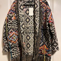 Great Condition - Never Worn Oversized Fit Aztec/Western Boho Print Colorful Cardigan With Fringe Trim Boho Tribal Print Perfect For Layering Black Jacquard Outerwear For Winter, Oversized Spring Outerwear With Tassels, Black Jacquard Winter Outerwear, Oversized Tassel Outerwear For Spring, Black Jacquard Outerwear For Fall, Oversized Long Sleeve Outerwear With Tassels, Oversized Tasseled Outerwear With Long Sleeves, Multicolor Spring Outerwear With Tassels, Spring Multicolor Outerwear With Tassels