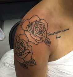 a woman with a rose tattoo on her shoulder