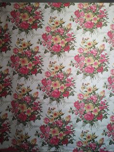 a floral wallpaper with pink and yellow flowers