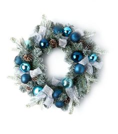 a christmas wreath with blue and silver ornaments