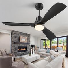 a living room with white furniture and a black ceiling fan in the middle of it