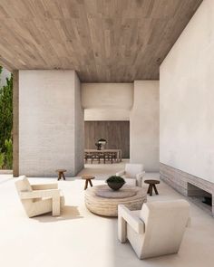 a living room filled with white furniture next to a wooden ceiling