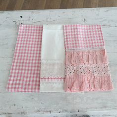 three pieces of pink and white checkered fabric