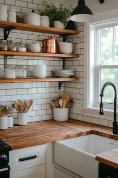 the kitchen counter is clean and ready to be used for cooking or baking, with wooden utensils on it