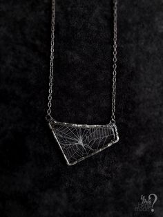 ( Spiderweb necklace, real cobweb resin, spiderweb pendant, caught in resin, triangle necklace, gothic necklace, captured in resin, spider web preserved, rustic goth pendant, statement necklace, golden ratio cobweb, spinnerets silk, rustic soldered ) This is real spiderweb pendant. It's completely handmade, in three dimensional triangle-ish shape pendant, on long gunmetal chain. Pendant is transparent and spiderweb looks the best on black clothes, it's very vibrant and made with love although is stolen from a spider (but spider wasn't harmed nor were other insects). Pendant is made with high quality non-yellowing resin and lead free tin. You will recieve exact product as it's in the picture.  Dimensions of pendant are: 6,5 cm x 4 cm Necklace length (chain + pendant, height from top to bott Spider Web Necklace Diy, Clay Necklace Pendant, Spiderweb Chain, Spiderweb Choker, Spiderweb Necklace, Spider Web Necklace, Goth Pendant, Real Spiders, Spider Necklace