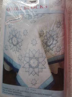 the package contains two quilted bedspreads with stars on them, and one is