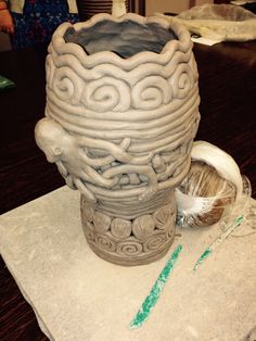 a large vase sitting on top of a table